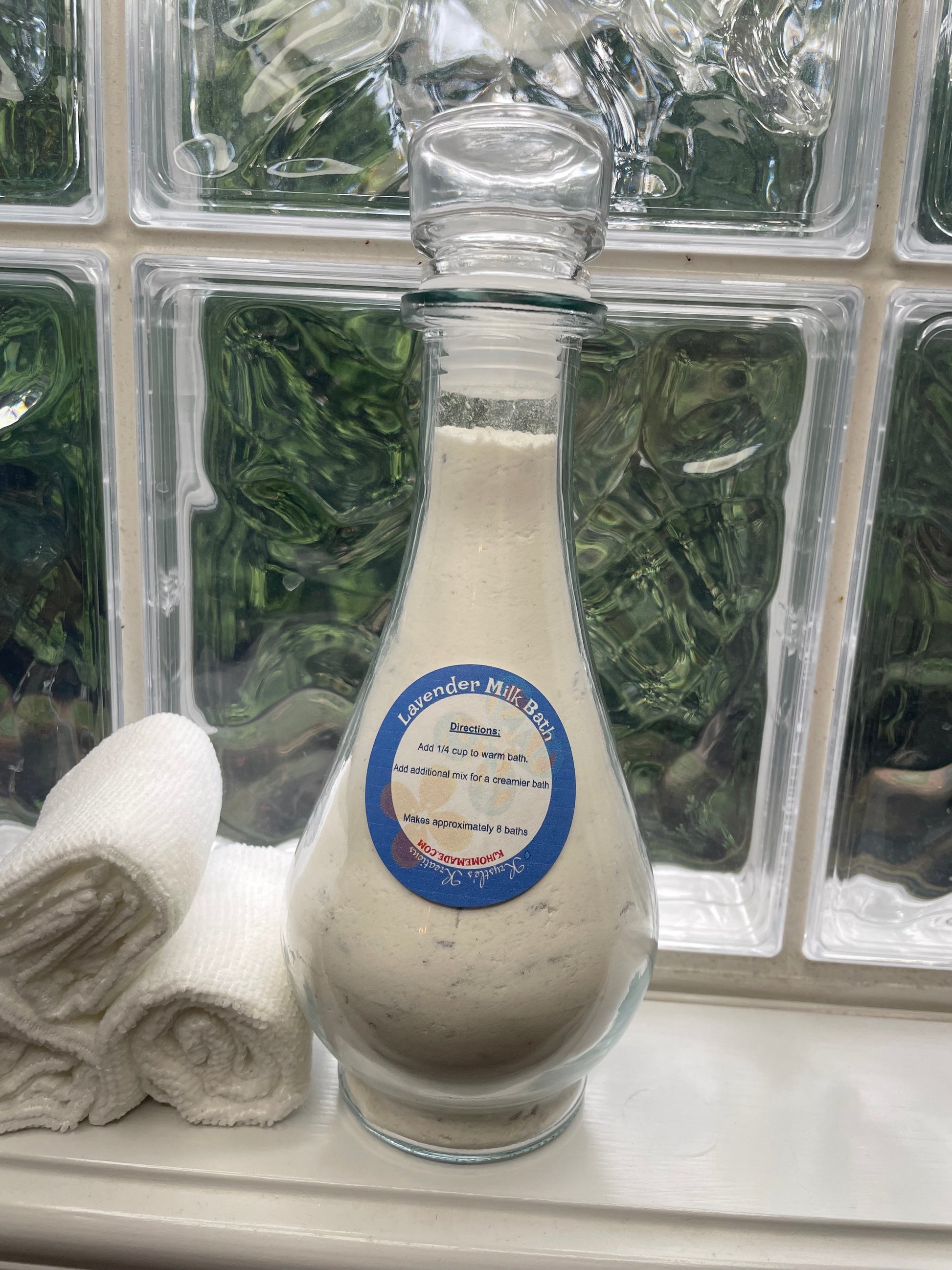 Bottle Of Lavender Milk Bath next to a window